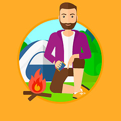 Image showing Man kindling campfire.