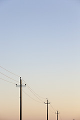 Image showing power poles in the field