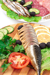 Image showing sliced herring on wooden plate