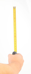 Image showing hand measuring by tape measure