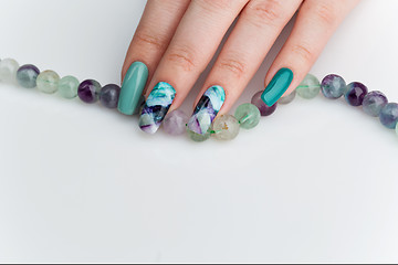 Image showing Closeup of woman hand with colorful nails