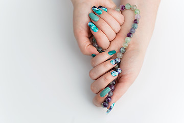 Image showing Closeup of woman hands with colorful nails