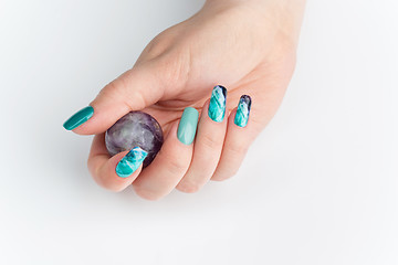 Image showing Closeup of woman hands with colorful nails