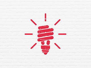 Image showing Business concept: Energy Saving Lamp on wall background