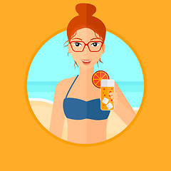 Image showing Woman with cocktail on the beach.