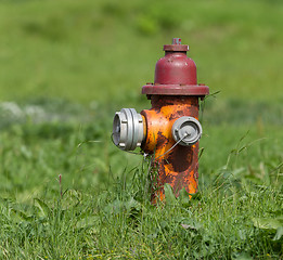 Image showing Red fire hydrant on a city sidewalk