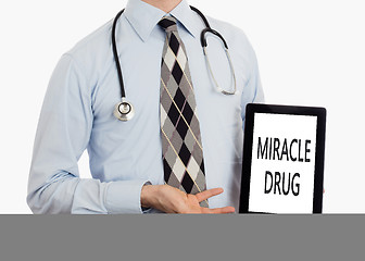 Image showing Doctor holding tablet - Miracle drug