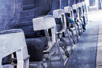 Image showing Empty old airplane seats in the cabin, selective focus, vintage 