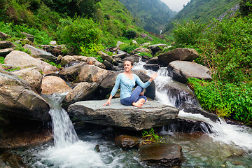 Image showing Woman doing Ardha matsyendrasana asana outdoors