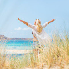 Image showing Free Happy Woman Enjoying Sun on Vacations.