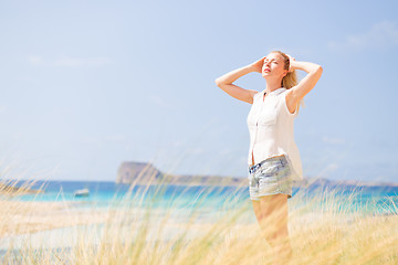 Image showing Free Happy Woman Enjoying Sun on Vacations.