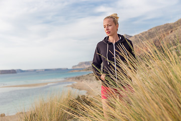 Image showing Relaxed Happy Woman Enjoying Walk on Beach