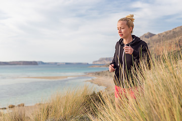 Image showing Active Woman Jogging on Beach