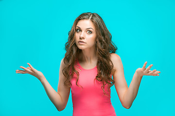 Image showing Portrait of young woman with shocked facial expression