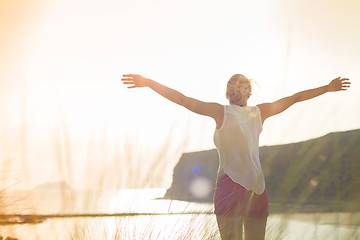 Image showing Free Happy Woman Enjoying Sun on Vacations.