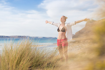 Image showing Free Happy Woman Enjoying Sun on Vacations.