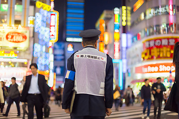 Image showing Japanese policeman standing in Shinjuku, Tokyo, Japan.