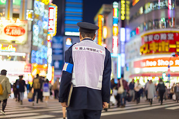 Image showing Japanese policeman standing in Shinjuku, Tokyo, Japan.