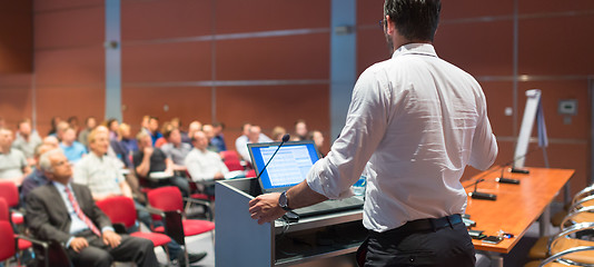 Image showing Public speaker giving talk at Business Event.