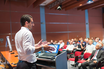 Image showing Public speaker giving talk at Business Event.