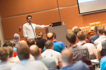 Image showing Business speaker giving a talk in conference hall.