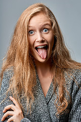 Image showing Woman playfully sticking her tongue out