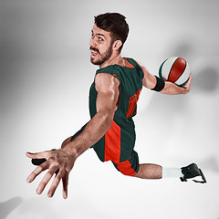 Image showing Full length portrait of a basketball player with ball