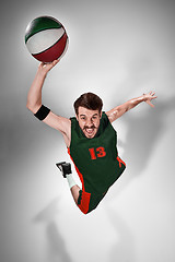 Image showing Full length portrait of a basketball player with ball