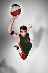 Image showing Full length portrait of a basketball player with ball