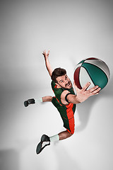 Image showing Full length portrait of a basketball player with ball