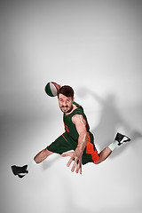 Image showing Full length portrait of a basketball player with ball