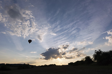 Image showing Sunset sky and silhouette of a hot air balloon