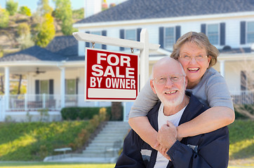 Image showing Senior Adult Couple in Front of Real Estate Sign, House