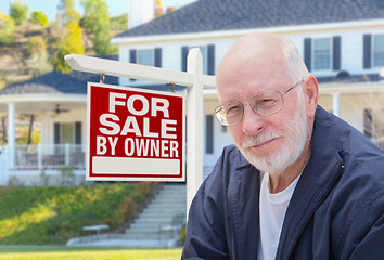 Image showing Senior Adult Man in Front of Real Estate Sign, House