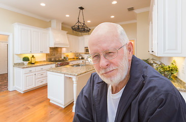 Image showing Happy Senior Man In Custom Kitchen Interior