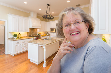 Image showing Happy Senior Woman In Custom Kitchen Interior