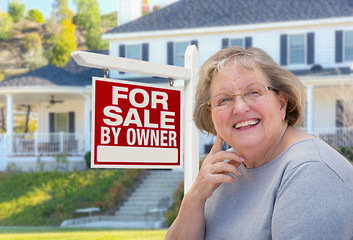 Image showing Senior Adult Woman in Front of Real Estate Sign, House