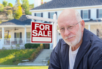 Image showing Senior Adult Man in Front of Real Estate Sign, House