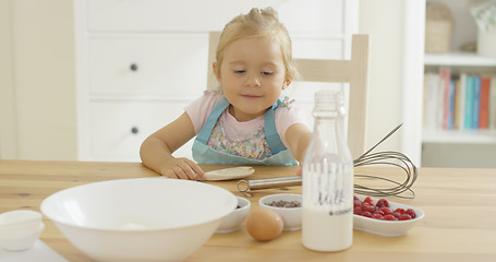 Image showing Cute baby baking in a kitchen