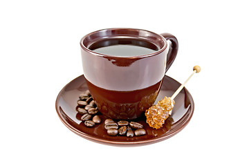 Image showing Coffee in brown cup with sugar and grains