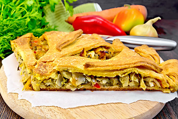 Image showing Pie with cabbage and sorrel on parchment