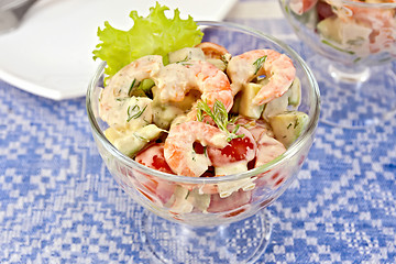 Image showing Salad with shrimp and tomatoes in glass on linen tablecloth