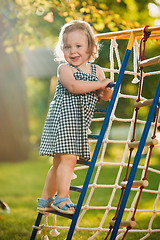 Image showing The little baby girl playing at outdoor playground