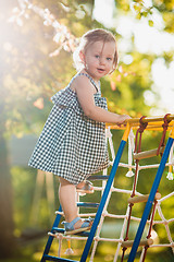 Image showing The little baby girl playing at outdoor playground