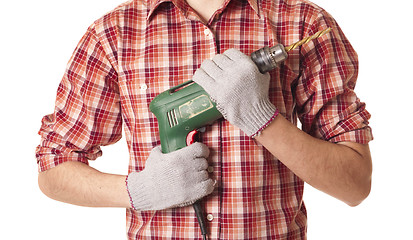 Image showing hands handling an electric drilling machine