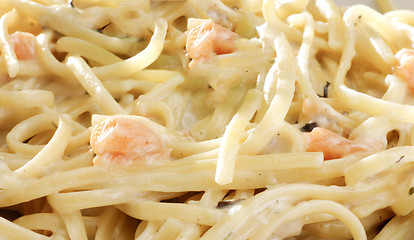 Image showing Italian pasta close-up on yellow gradient surface.