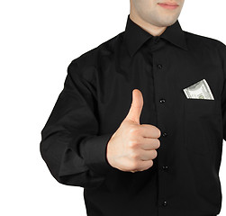 Image showing Businessman with money in pocket showing okay sign