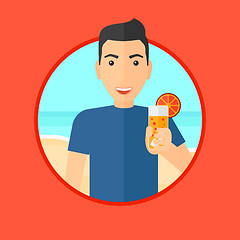 Image showing Man with cocktail on the beach.