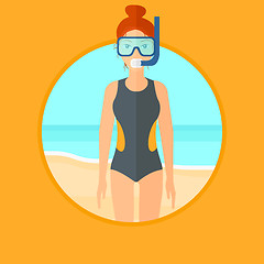 Image showing Female scuba diver on the beach.