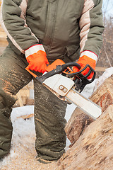 Image showing Carpenter working at sawmill